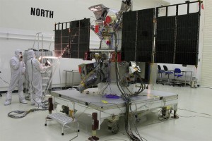 Workers conduct a light test on the solar arrays. Credits: NASA